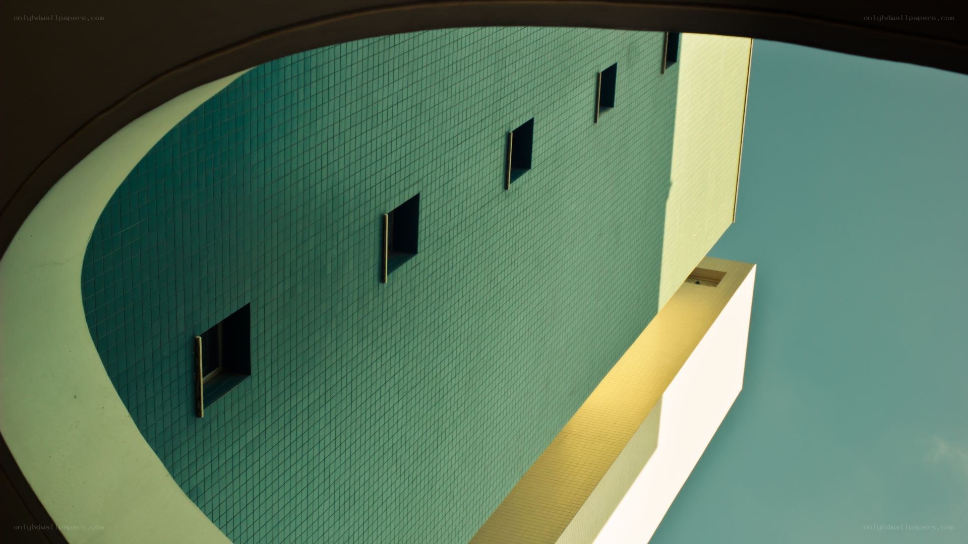 green tiled building facade