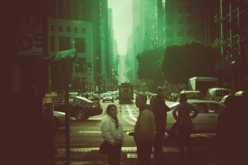 Green-tinted city street scene