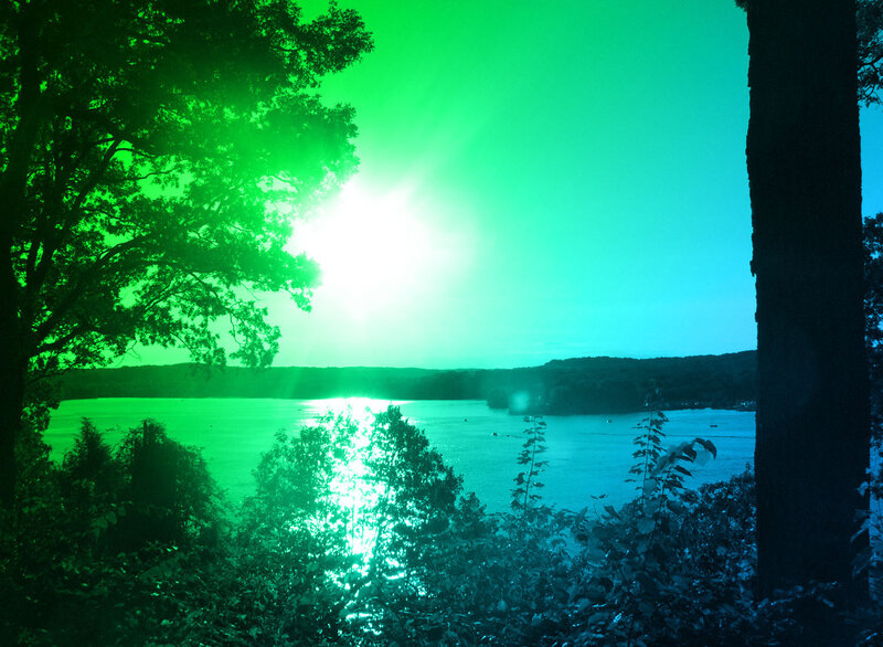 Green-tinted lake sunset