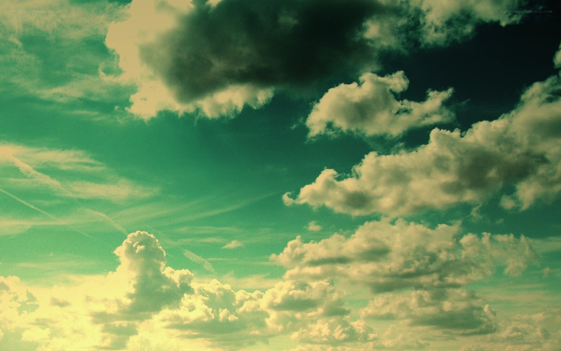 green-tinted sky with clouds