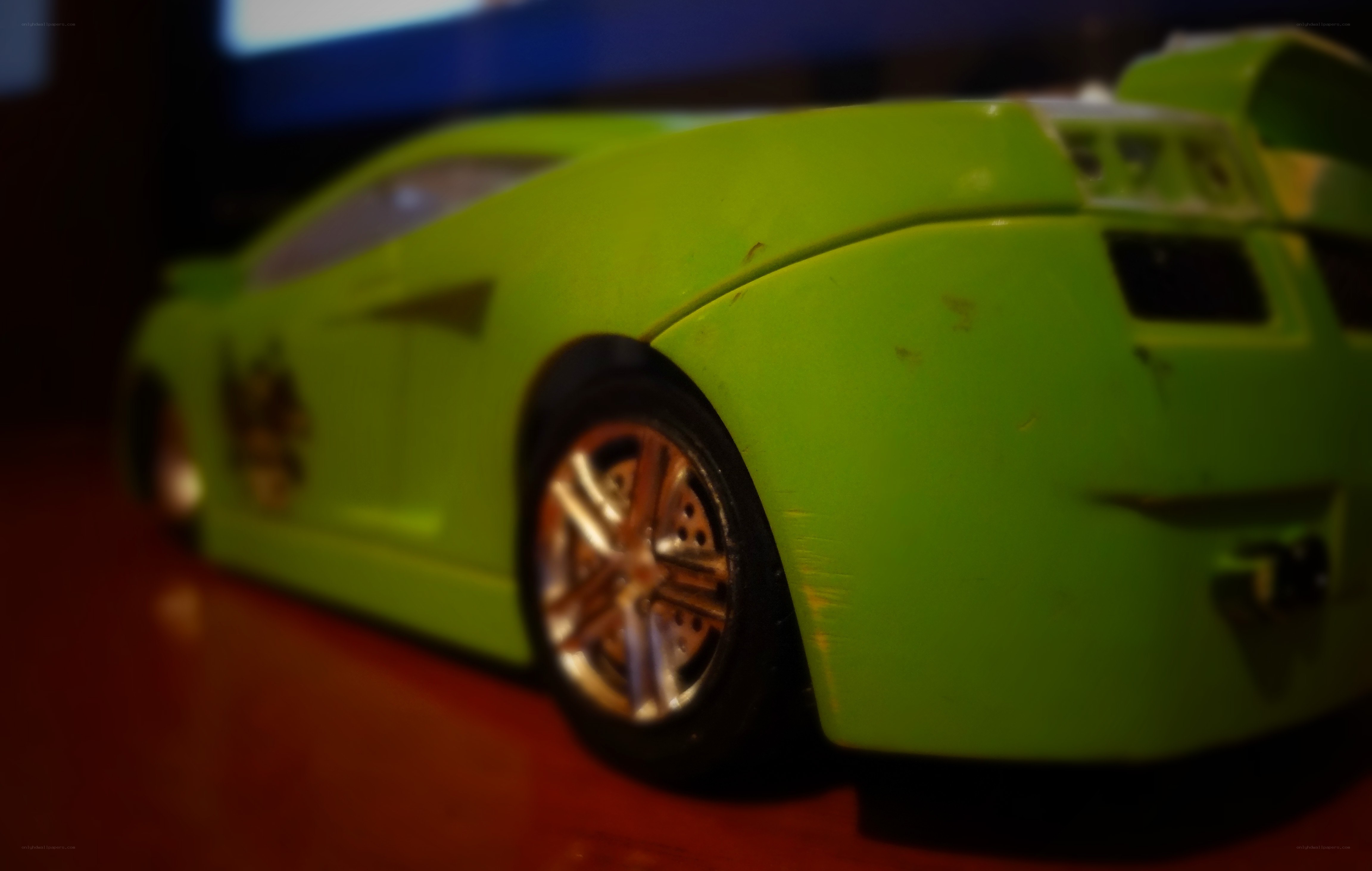 green toy car on table