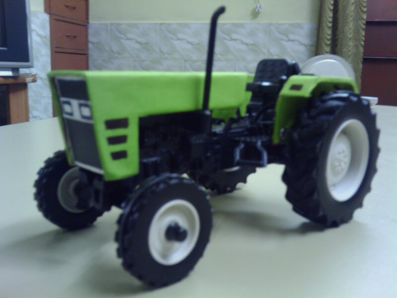 Green Toy Tractor — Neutral, Photograph, Table, Television