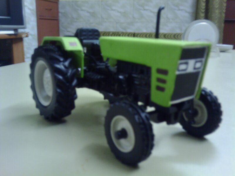 Green Toy Tractor — Neutral, Photograph, Table