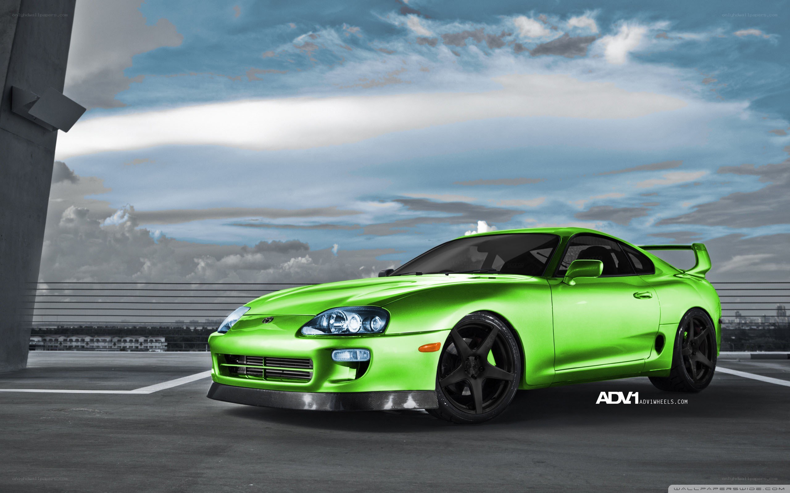 green toyota supra on rooftop