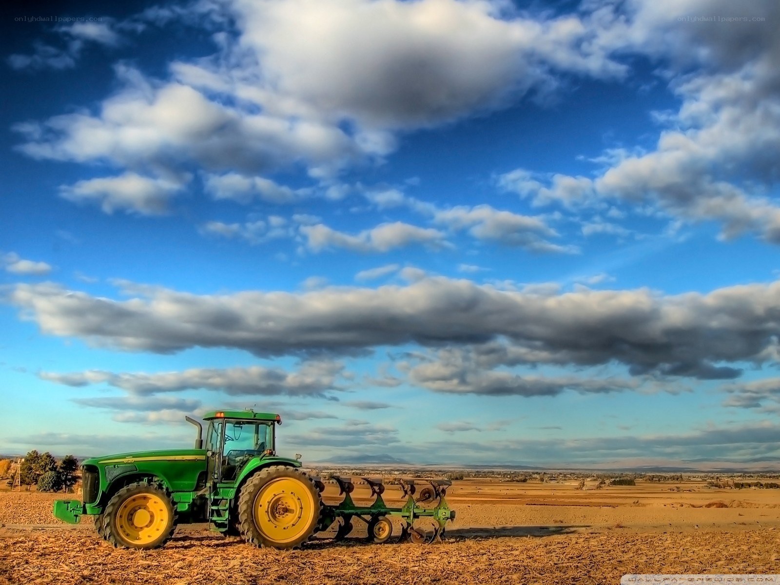 Green tractor in a field