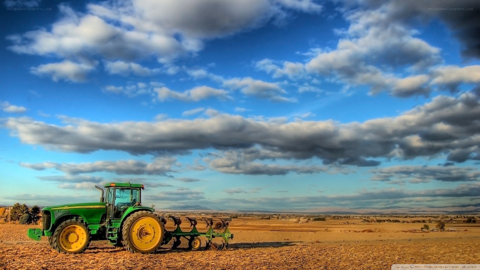 Green tractor in a field