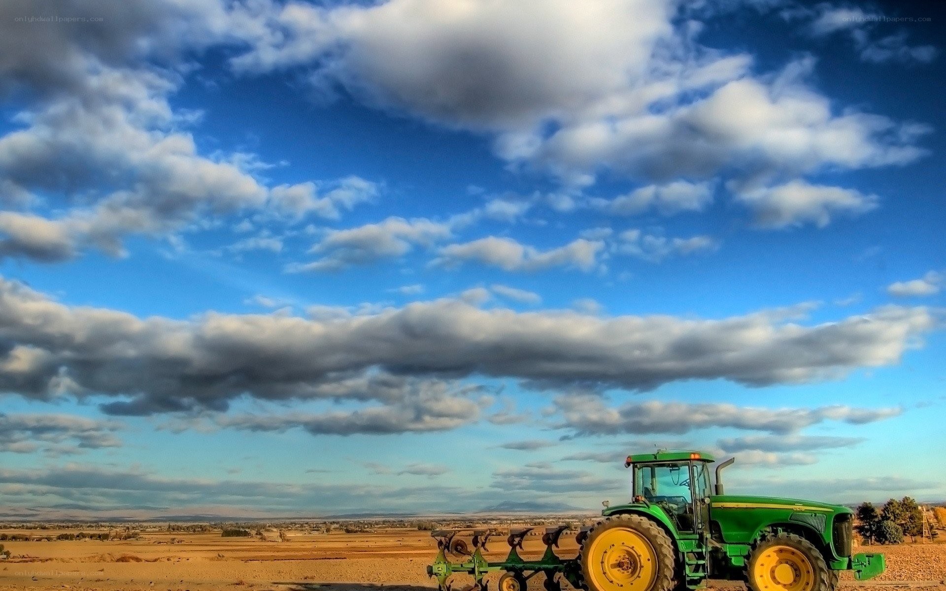 Green tractor in a field