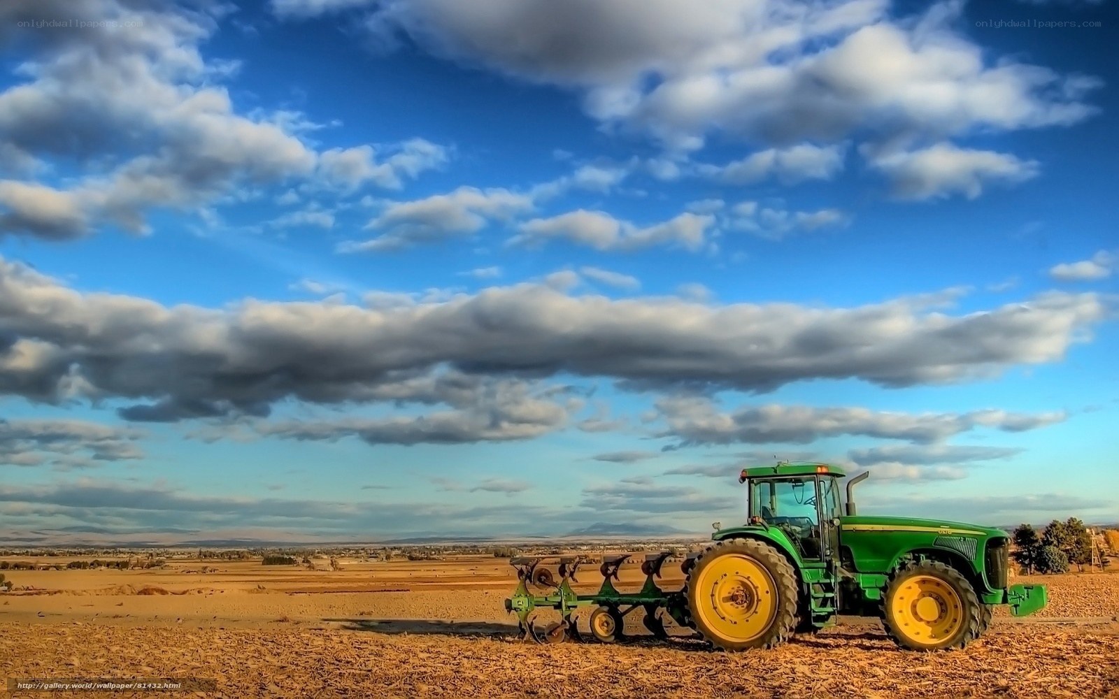 Green tractor in a field