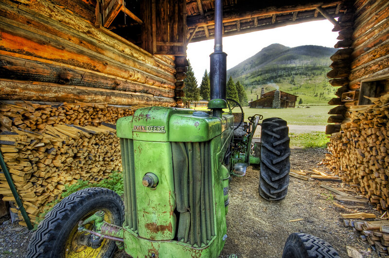 Green Tractor in Barn