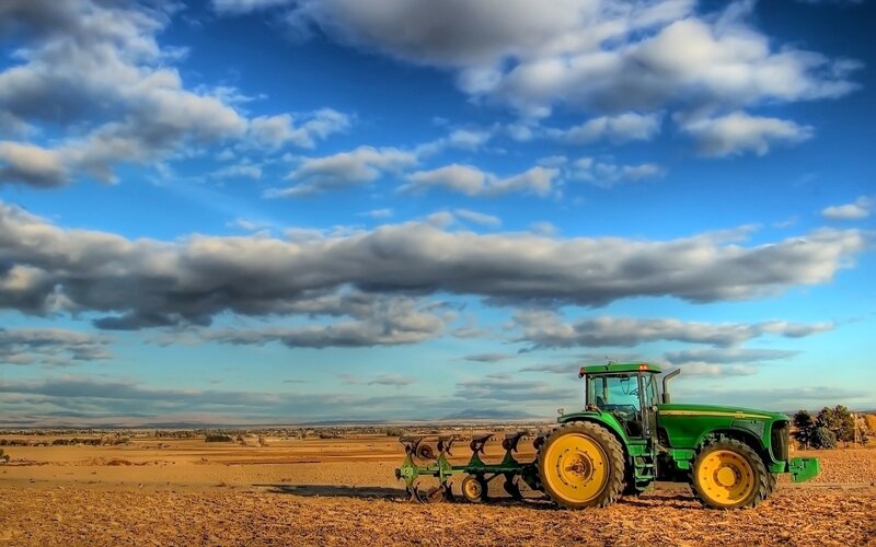 Green Tractor in Field — Blue, Dramatic, Afternoon