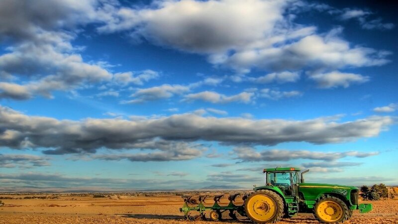 Green Tractor in Field — Blue, Dramatic