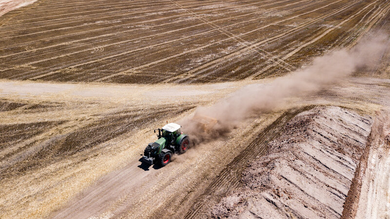 Green Tractor in Field — Brown