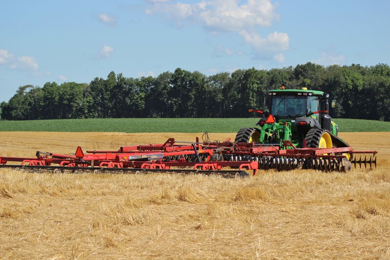 Green Tractor in Field — Calm, Afternoon, Photograph