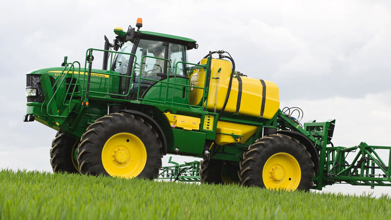 Green Tractor in Field — Calm, Afternoon