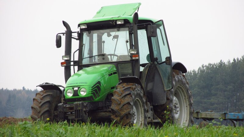 Green Tractor in Field — Calm, Morning