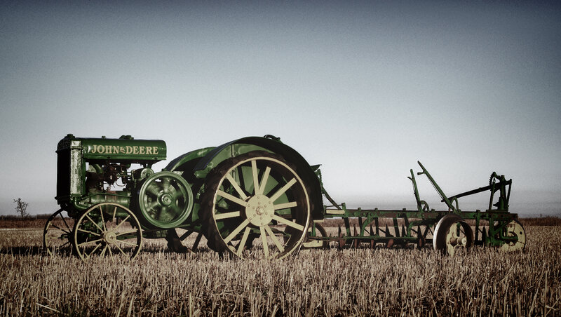 Green Tractor in Field — Dramatic, Photograph