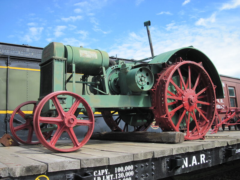 Green Tractor on Flatcar