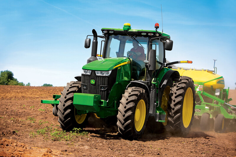 Green Tractor Plowing Field — Active