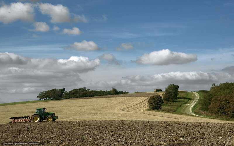 Green Tractor Plowing Field — Blue