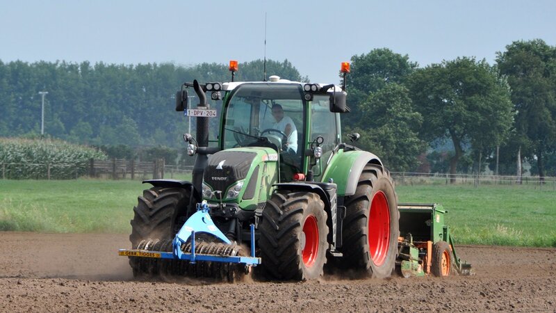 Green Tractor Plowing Field — Calm, Afternoon