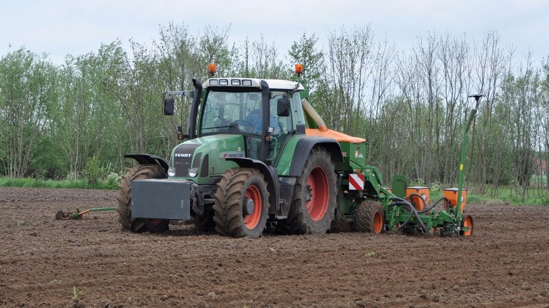 Green Tractor Plowing Field — Calm, Morning