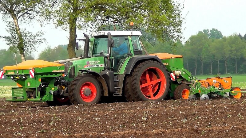 Green Tractor Plowing Field — Calm