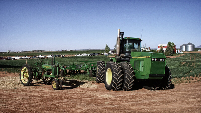 Green Tractors in Field