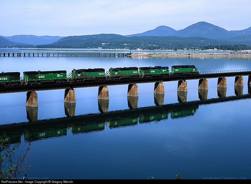 Green train on a bridge