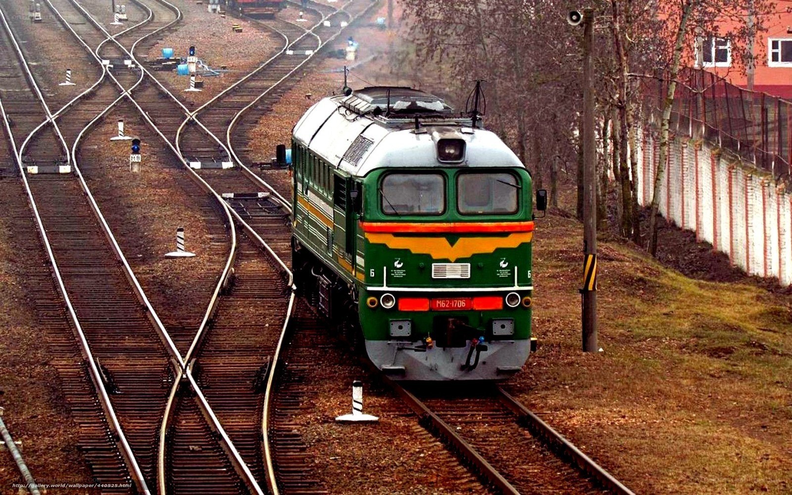 Green train on railway tracks