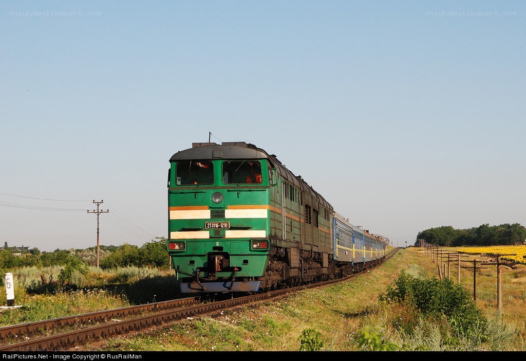Green train on rural track