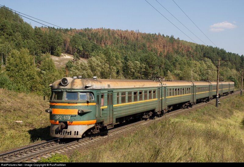 Green Train on Tracks — Serene, Afternoon, Photograph