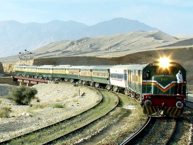 Green Train on Tracks — Serene, Afternoon