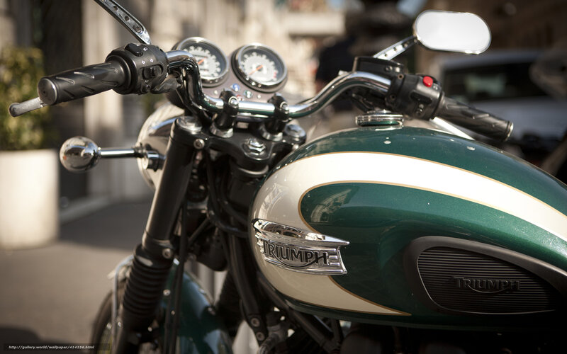 Green Triumph motorcycle front view