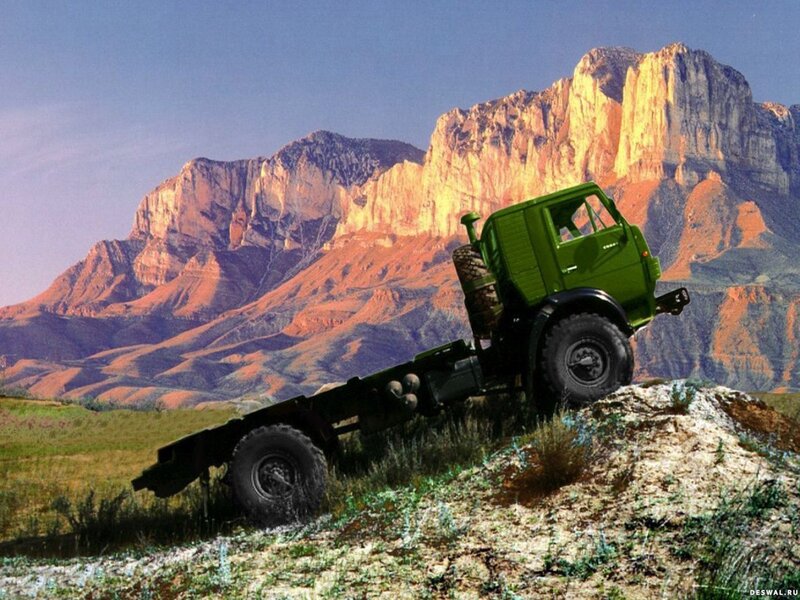 Green truck on rocky terrain