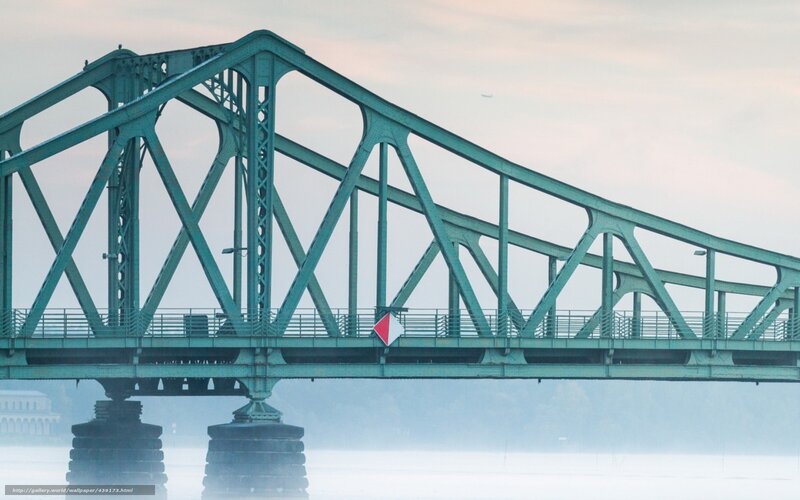 Green truss bridge over river
