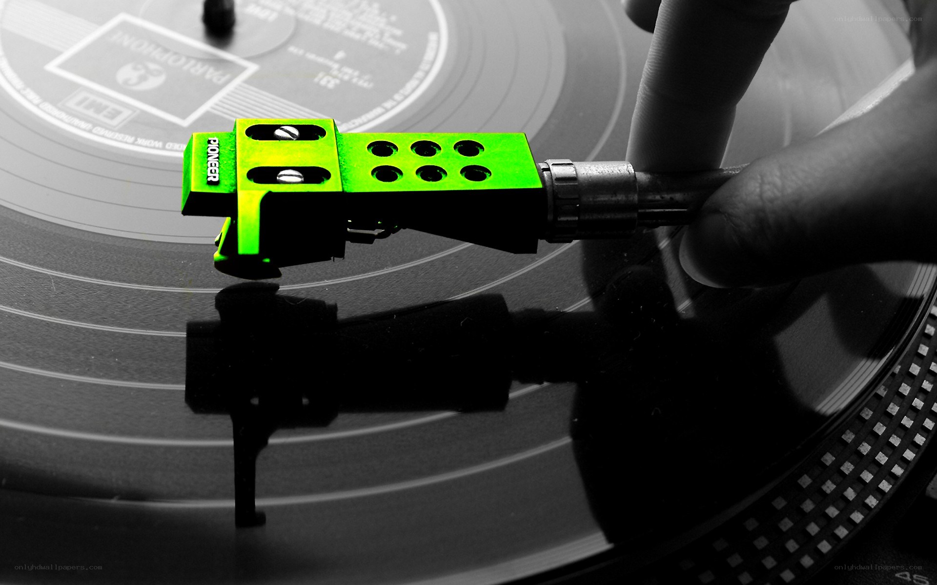 green turntable stylus on vinyl