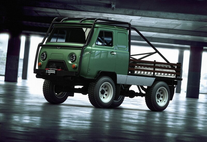 green utility truck in garage