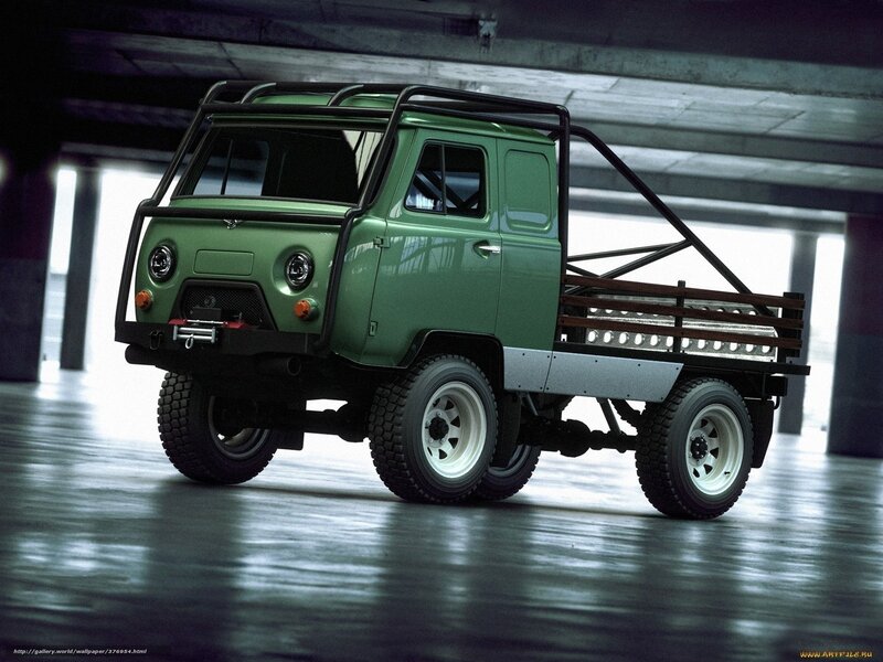 green utility truck in garage