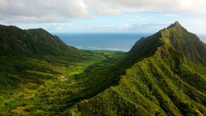 green valley between mountains