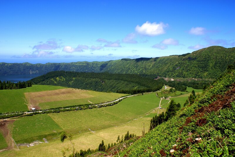Green valley with lake and mountains