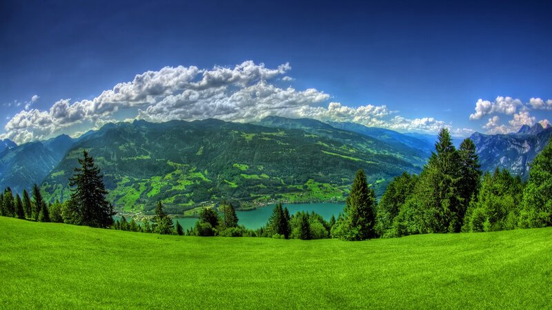 Green Valley with Lake — Serene, Afternoon, Photograph, Mountains, Trees, Clouds