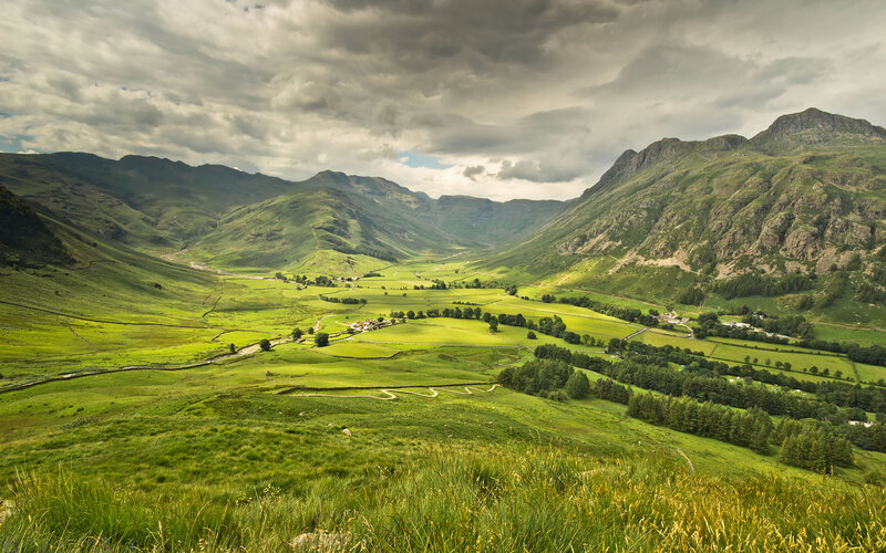 Green Valley with Mountains — Dramatic, Afternoon, Photograph, Clouds
