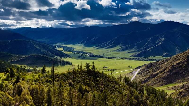 Green Valley with Mountains — Dramatic, Afternoon, Photograph, Road