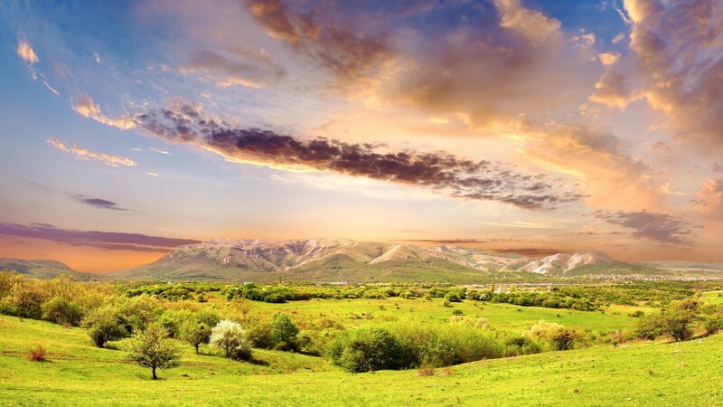 Green Valley with Mountains — Serene, Sunset, Photograph, Clouds, Trees