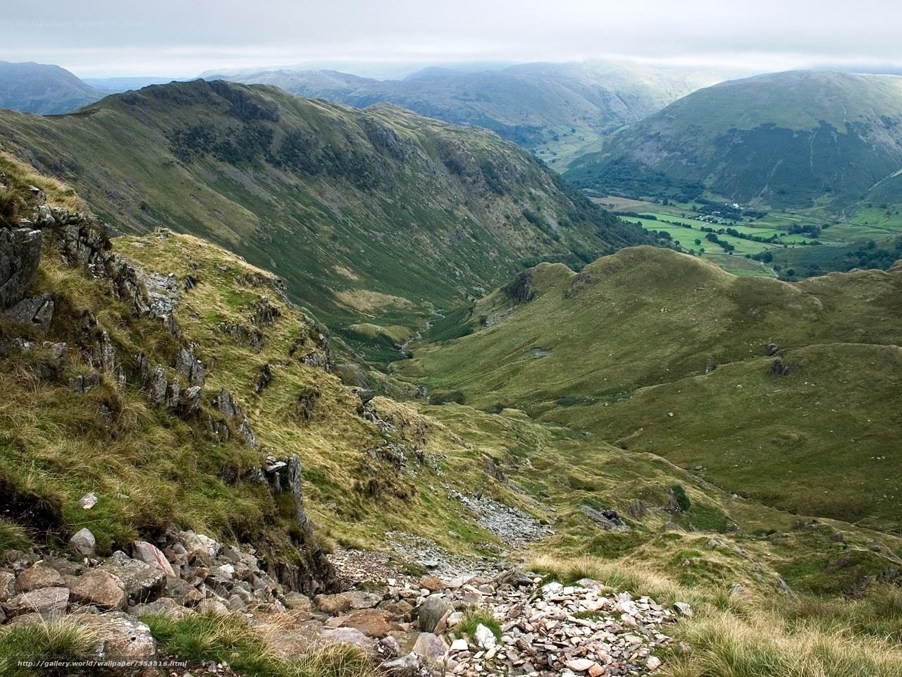 Green valley with rocky hills