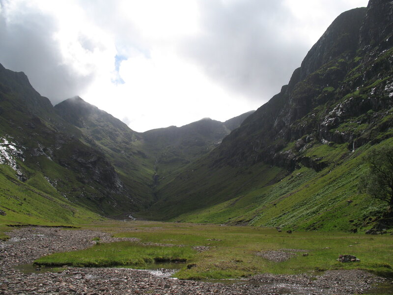 green valley with rocky stream