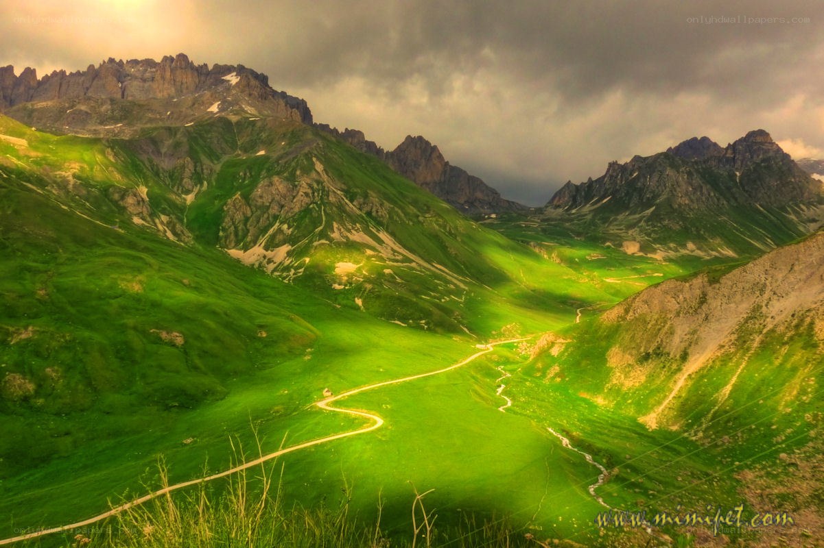 Green valley with winding road