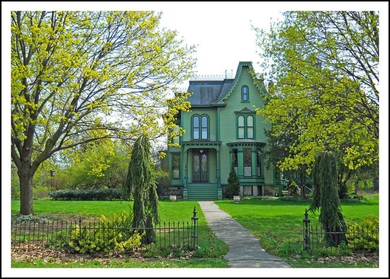 Green Victorian house in spring