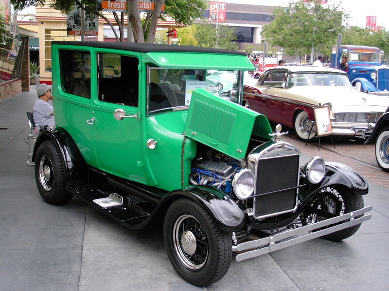 Green vintage car at a show