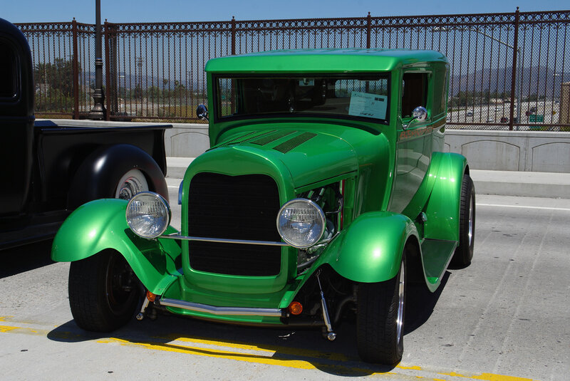 green vintage car on display